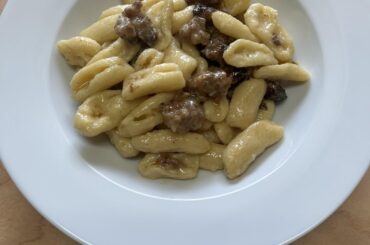 Strangulet with sausage, Grana Padano, and tossed with a butter sauce