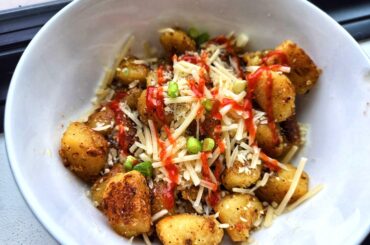 Sauteed Garlic Gnocchi w/ Shredded Parm, Sriracha & Green Onion