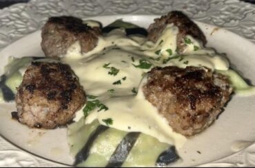 Homemade ravioli filled with a creamy chanterellericotta parmesan filling. Served with a reduced parmesano reggiano white wine sauce and homemade garlic meatballs