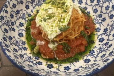 Red sauce, burrata, herb oil and pistachio