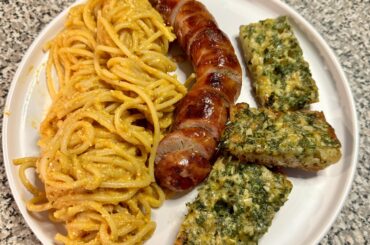 Creamy Tomato Feta pasta with Garlic bread and Grilled sausage