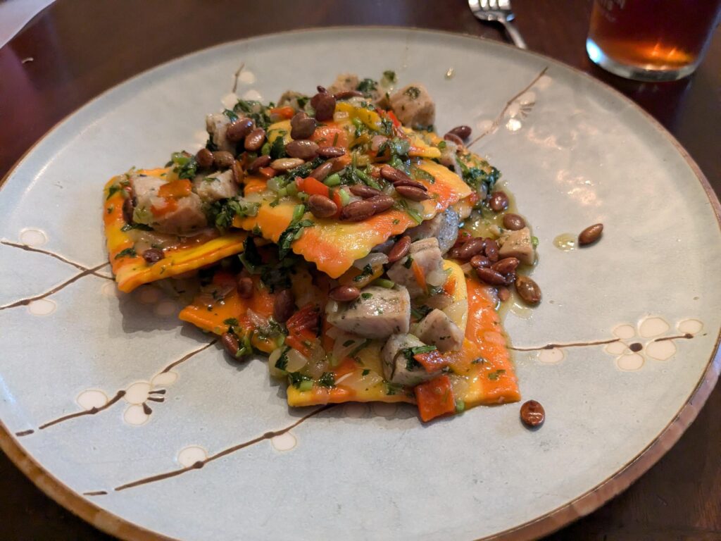 Ravioli do Zuca with toasted pepitos, sausage and cilantro Ravioli do Zuca with toasted pepitos, sausage and cilantro