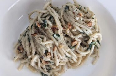 Homemade spaghetti with gorgonzola cream sauce and walnuts.