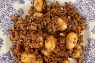 Homemade gnocchi with ragu of lentils and mushrooms