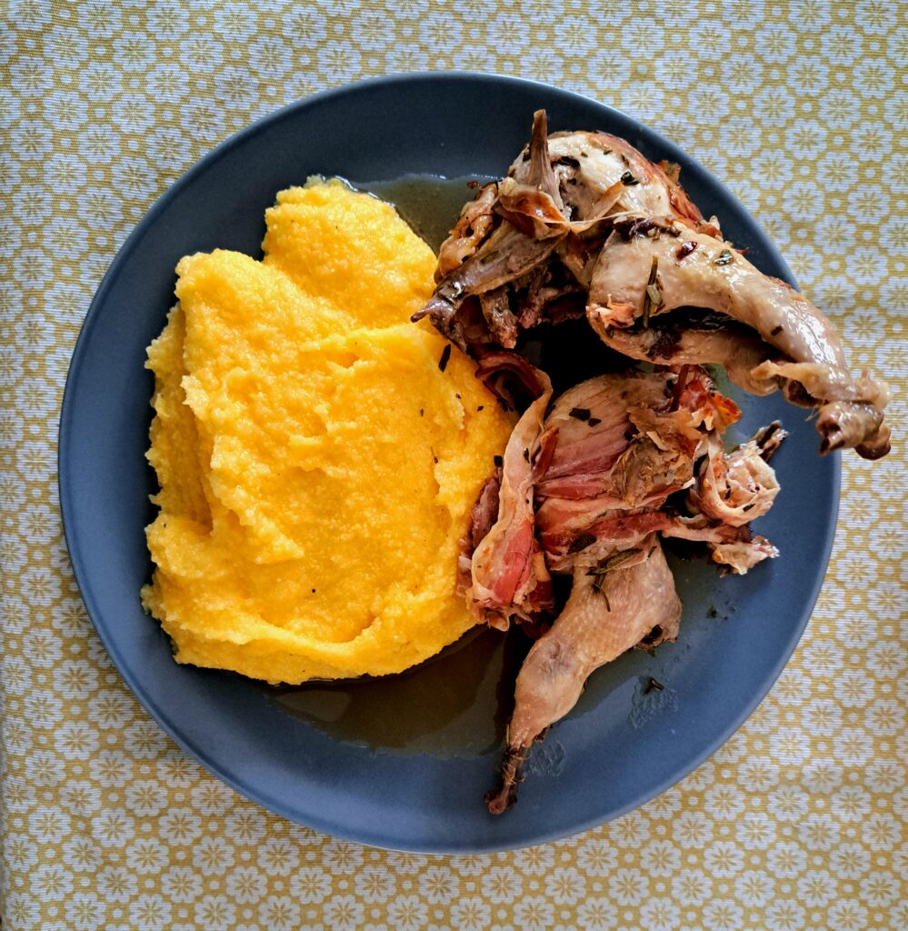 Polenta with quail rolled in pancetta