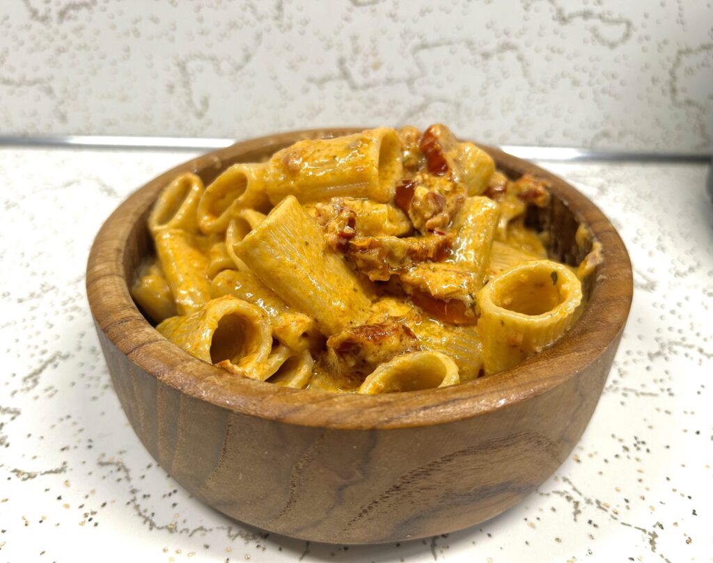Sun dried tomato pesto cream sauce with mezzi rigatoni