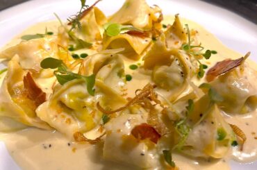 Pea Tortellini with creamy parmesan sauce, prosciuto chips and basil oil