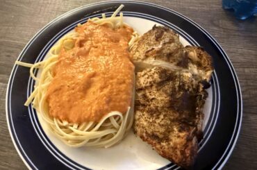 Homemade vodka sauce on grilled chicken and linguine.