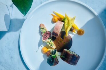 Fine dining Mushroom dry fruits and spinach stuffed Chicken Ballantine .Modern cuisine chef.