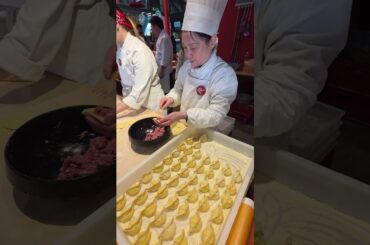 Preparing Chinese Dumplings. Food Festival in Italy