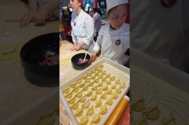 Preparing Chinese Dumplings. Food Festival in Italy