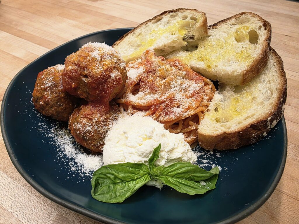 Spaghetti pomodoro with meatballs and ricotta
