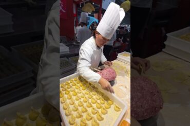 Filling Chinese Dumplings. Italy Food Festival