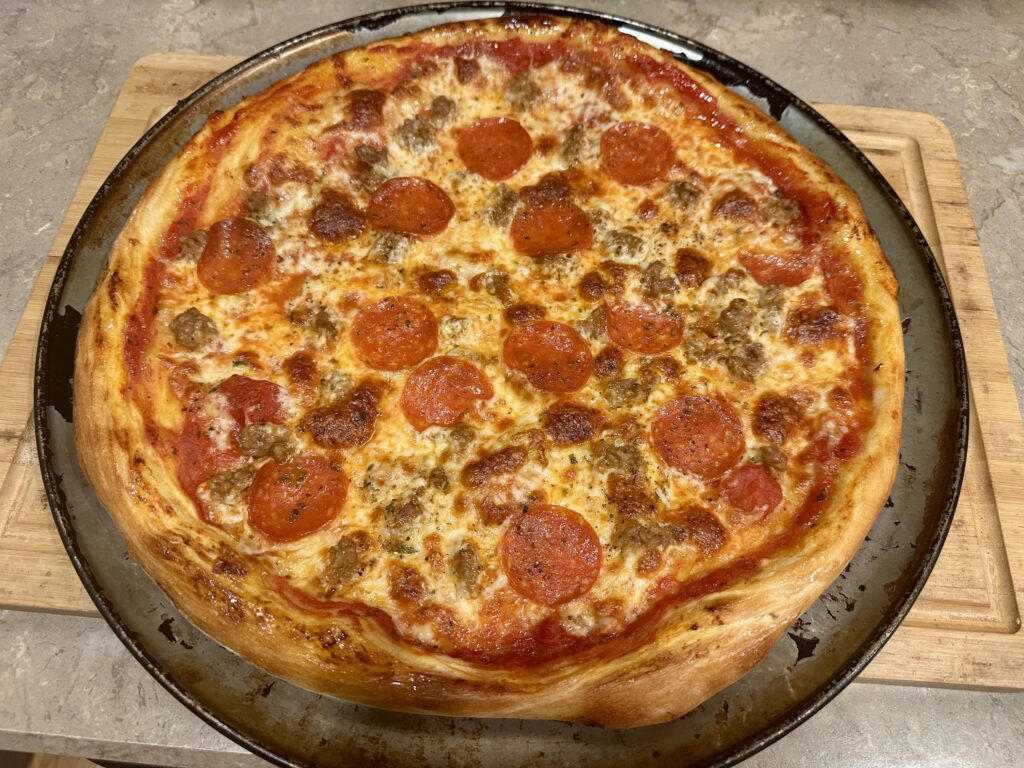 Homemade NY Style 16 inch pizza with Hot Sausage and Pepperoni…Made it last night…It was absolutely delicious!