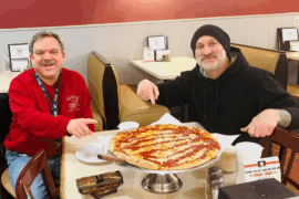 My husband and I enjoying a pizza for our 12th anniversary ❤️ 🍕😁