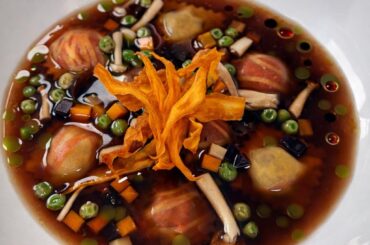 Cherry Braised Short Rib Ravioli, Cherry Broth Consommé, Chive Oil, Carrot, Peas, Mushroom, Crispy Sweet Potato