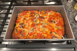 Homemade pepperoni, mushroom, pepper and onion pizza.