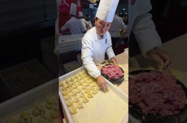 Filling Chinese Dumplings. Italy Food Festival