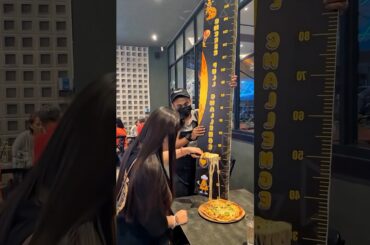 The restaurant staff told a girl that if she could stretch  #shortvideo #shorts #pizza