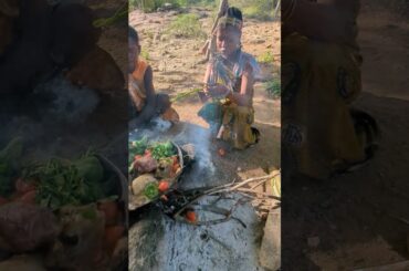Hadzabe mother' and father are cooking wild meat together #usa #news #italy #colombia #mexico #spain