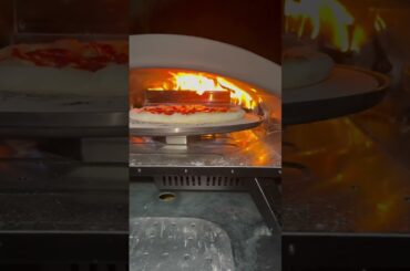 Stop babysitting your crust 🔥⁠ Bertello SimulFIRE 16" Rotating Outdoor Pizza Oven