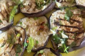 Grilled aubergines with a brine of oil, garlic, and chilli pepper.