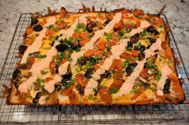 I call it the "Vaguely Asian" - roasted carrots/broccoli, chili crisp, green onions, sesame seeds, Sriracha yogurt.  96 hr dough + mozz/cheddar mix