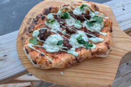 Birria pie with avocado lime crema and garlic habanero sauce