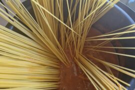 Cooking the pasta in the sauce