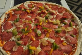 Came out alot more crispy than I really like i got distracted. Still delicious. Pepperoni, sautéed onions and peppers