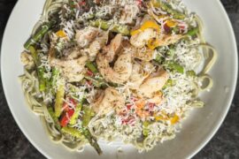 Spinach fettuccine with shrimp, asparagus and peppers sauced with Homemade pesto