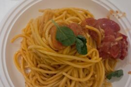 Pasta with garlic, oil, cherry tomatoes, and basil.