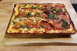 Detroit style pizza in a Lloyd pan