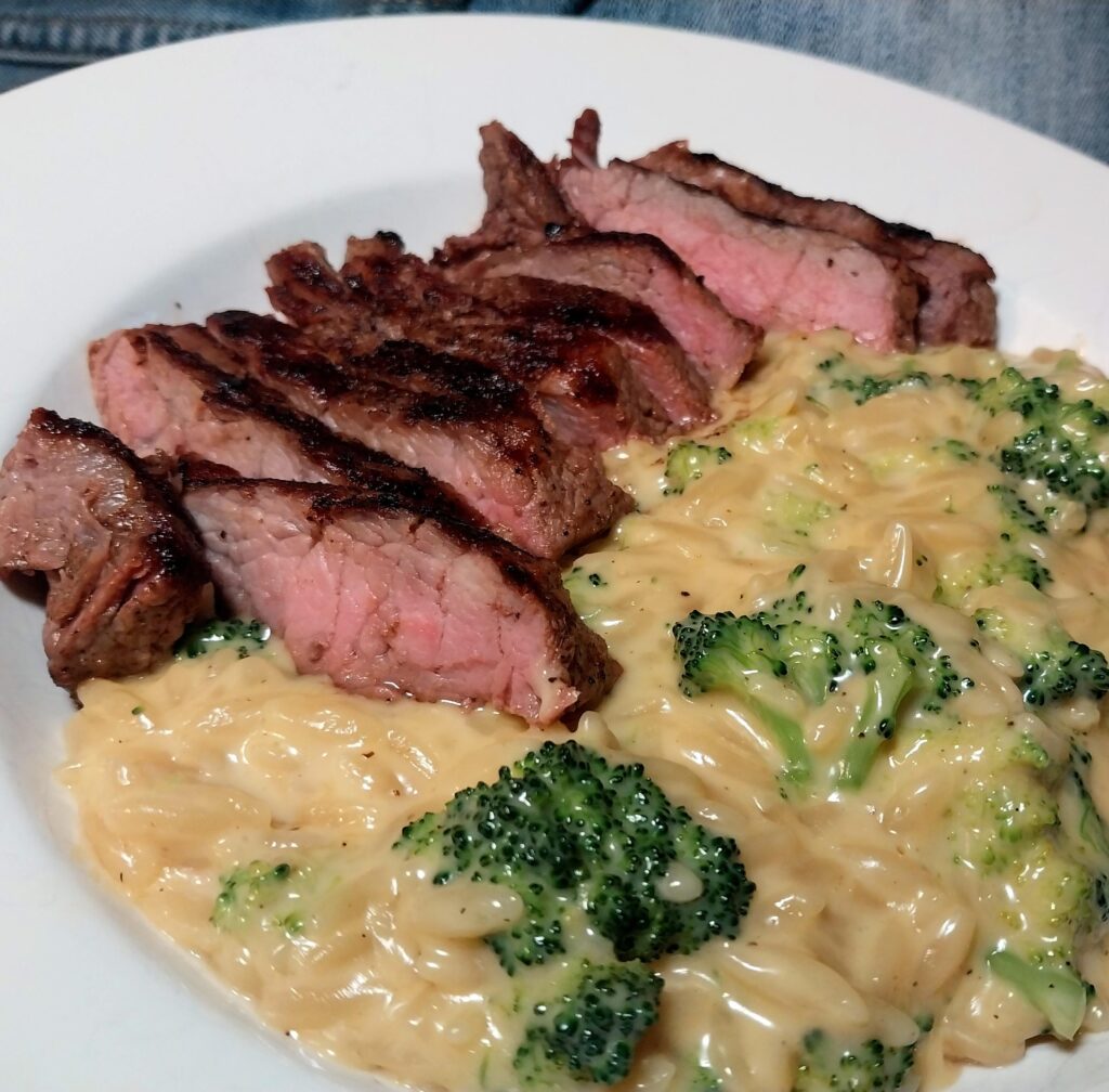Cheesy orzo and broccoli with sirloin steak