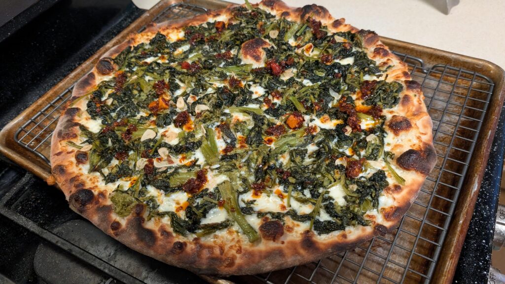Homemade on a steel. Sauteed broccoli rabe with garlic, topped with chili crisp