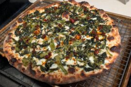 Homemade on a steel. Sauteed broccoli rabe with garlic, topped with chili crisp