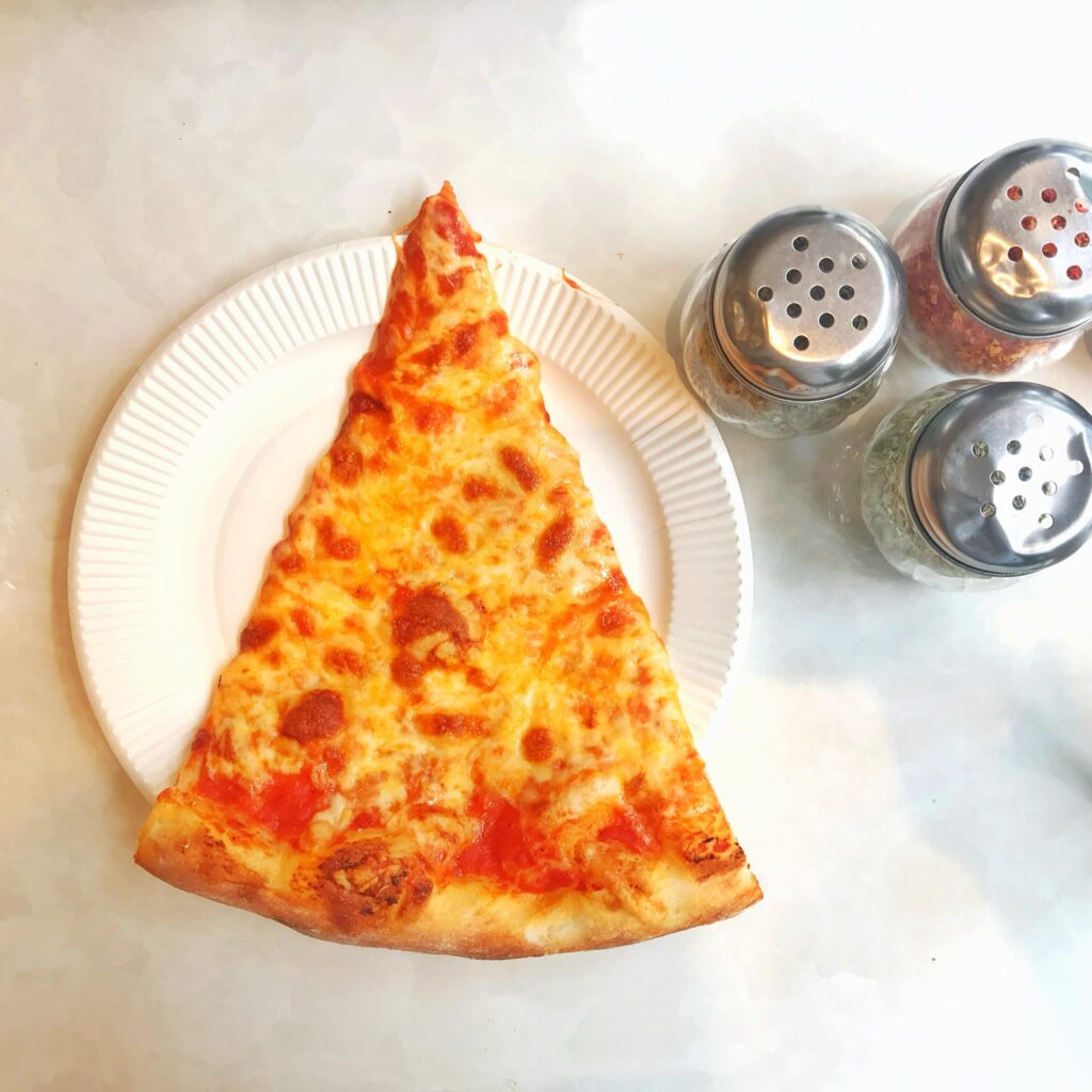 Just one regular slice. New York pizza by the slice… plain, how I like it. How do you like your pizza?