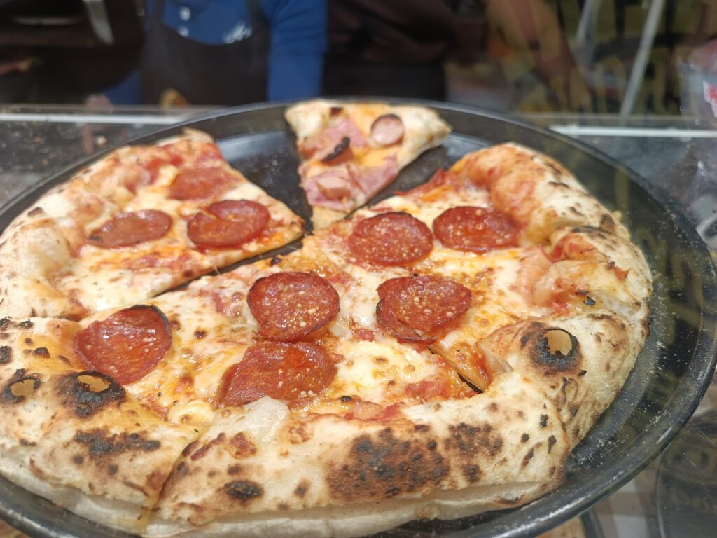 That wood-fired crust though... pepperoni perfection from a local spot in Bangkok.