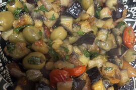 Pan-fried eggplant with cherry tomatoes, olives, and capers!