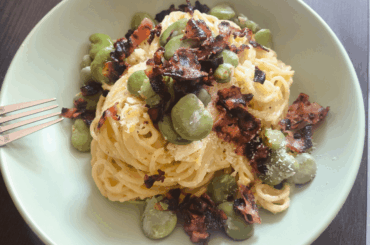 A variation on Alfredo. Pasta in a velvety butter and Parmesan sauce with broad beans and crispy bacon.