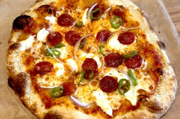 Pepperoni, long hots, red onion, fresh garlic, ricotta, pecorino, hot honey on a sesame seed crust