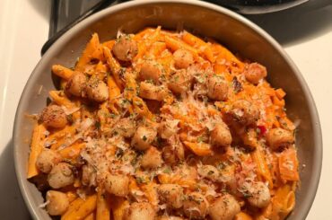 homemade spicy penne alla vodka with baby scallops