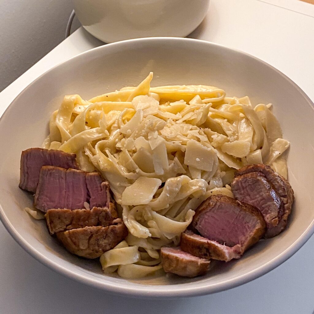 Parmesan tagliatelle with pork loin