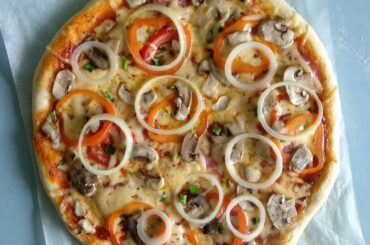 Homemade pizza with onions and peppers