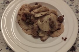 Home made corzetti with mushrooms and walnut pesto