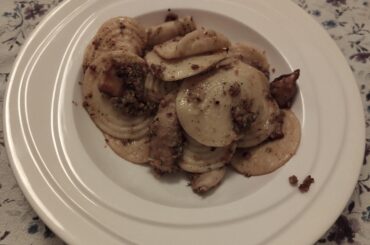 Home made corzetti with mushrooms and walnut pesto
