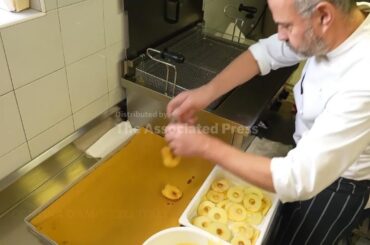 Olympics fans in Cortina enjoy apple fritters while they are hot for one day only