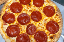 My mom made one pizza and my girlfriend made the other… which one looks better?