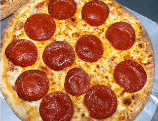 My mom made one pizza and my girlfriend made the other… which one looks better?