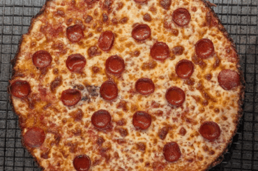 Thin crust pizza with a Detroit-inspired frico edge